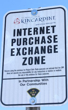 A sign indicating the Project Safe Trade zone in front of the South Bruce OPP detachment office in Kincardine